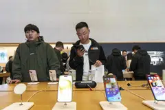 Customers at an Apple Store in Shanghai, March 15, 2024. Apple has deep ties in the country, its second-largest market. But there are signs that Chinese consumers are becoming a harder sell.