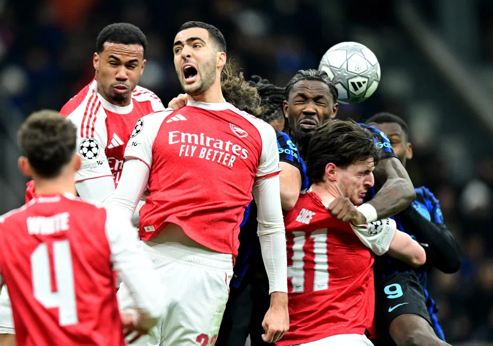 Arsenal (in red) in action against Inter Milan in the Champions League this week. The Gunners won the match 3-1.