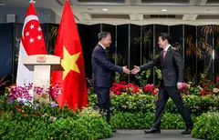 Prime Minister Lawrence Wong (right) and Communist Party of Vietnam General Secretary To Lam at Parliament House on Wednesday.