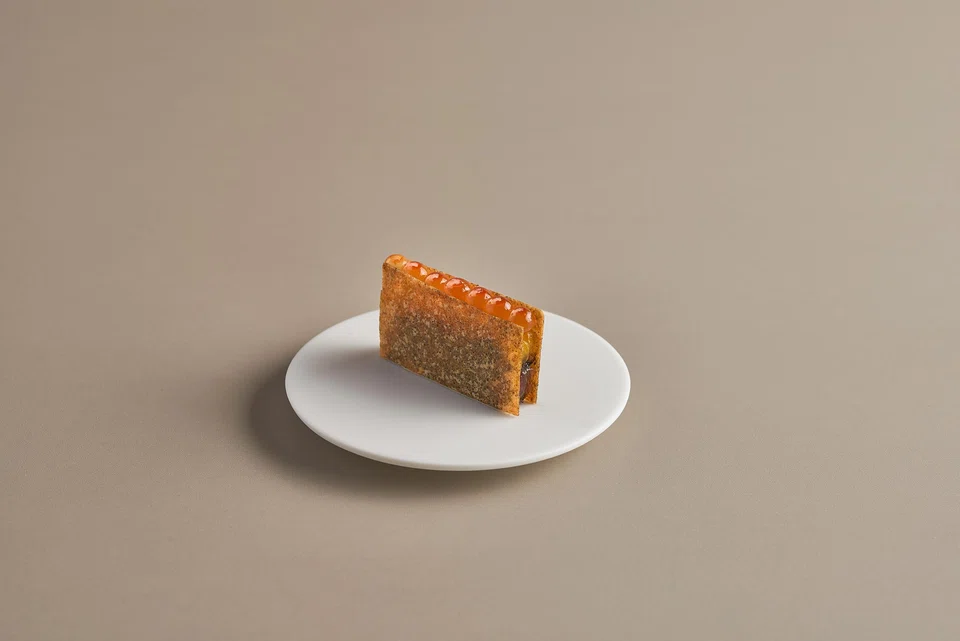 Salmon 'sandwich' is one of many intricate snacks to start off the meal.