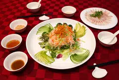 Teochew yu sheng drizzled with 98-year-old plum sauce.
