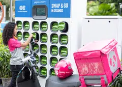 A foodpanda rider performing battery swap at a Gogoro station.