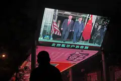 A screen showing the meeting between US President Donald Trump and China's President Xi Jinping in South Korea, outside a shopping mall in Beijing on Oct 30. China is not the rare-earth juggernaut it might seem to be.