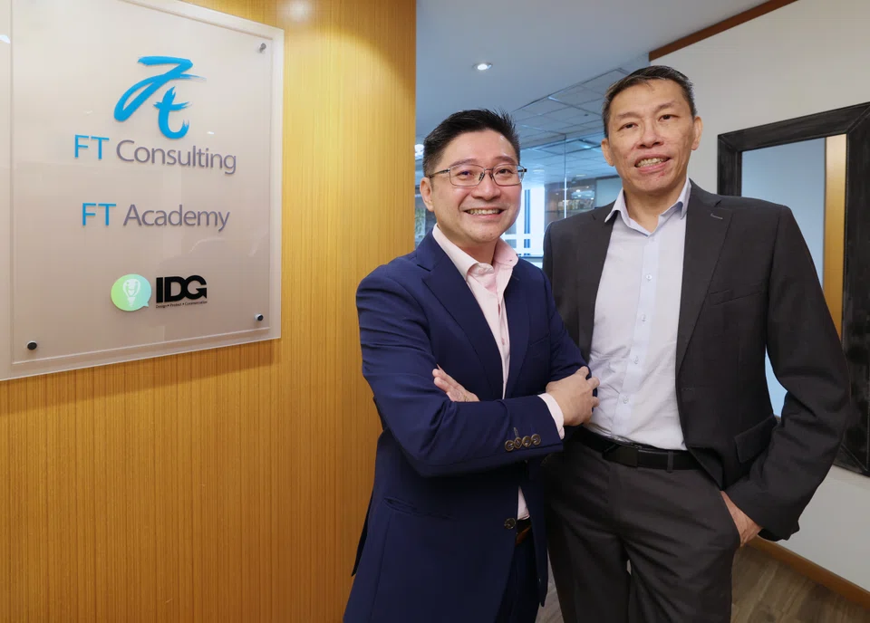 FT Consulting CEO Winston Chan (left) and executive chairman John Ong.