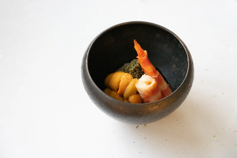 Cold somen in a salty dipping sauce served with prawns and uni.