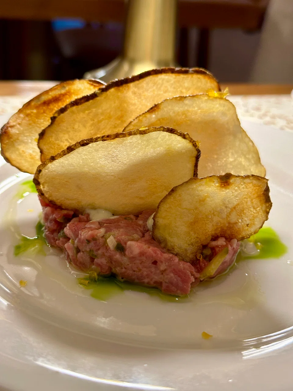 Wagyu beef battuta features tasty chopped beef tartare and truffle potato chips.
