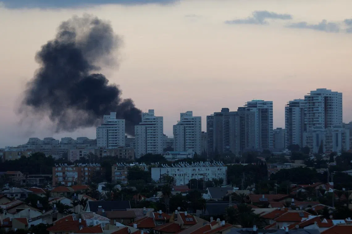 Smoke rises after rockets were launched on Saturday (Oct 7) in Ashkelon, a coastal Israeli city 13 km north of the border with the Gaza Strip.