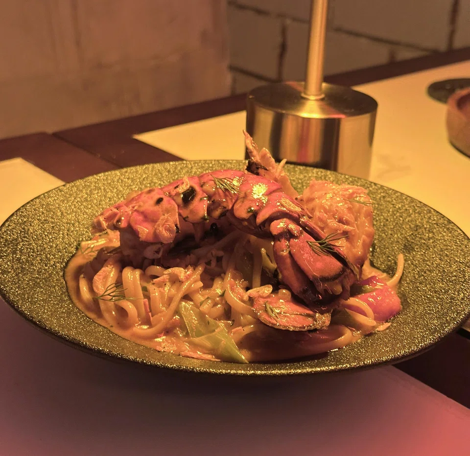 Crab linguine cooked in shellfish bisque and coconut milk.