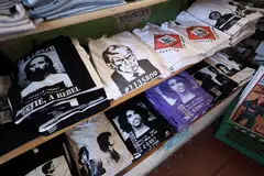 T-shirts with an image depicting the mugshot of former president Donald Trump have appeared on retail shelves, like in this store in Los Angeles, California. 