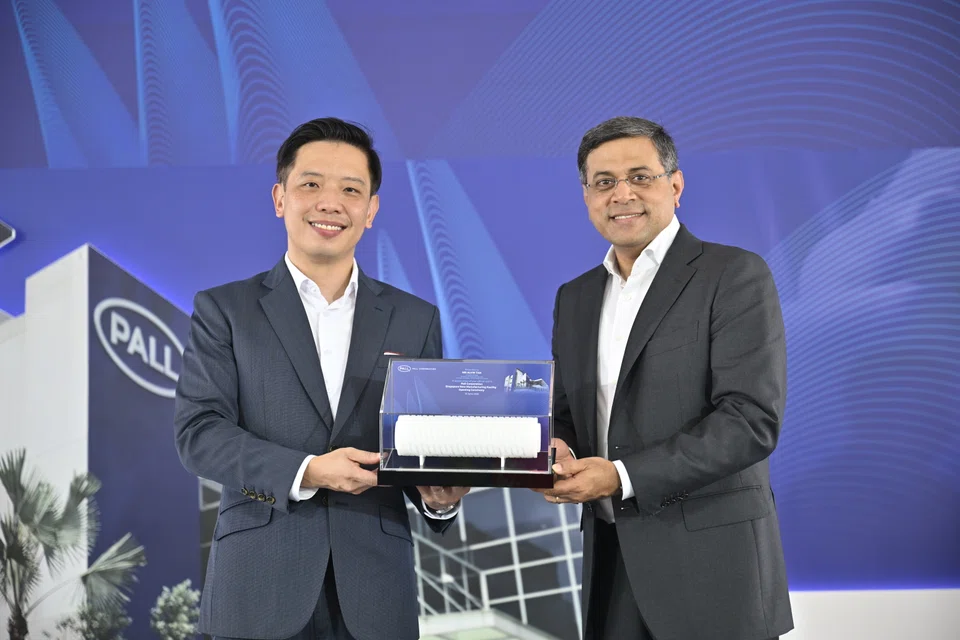 Singapore Minister of State for Trade and Industry Alvin Tan (left) with Pall Corp president Naresh Narasimhan at the opening ceremony of the company's new microelectronics filter facility at Jurong Industrial Estate.