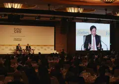 Deputy Prime Minister Lawrence Wong (on screen) noted that the world has not reached an equilibrium in its transition from a "unipolar world" to a "multipolar world".