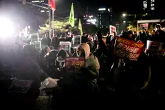 Protesters against South Korean President Yoon Suk Yeol call for his impeachment while occupying the street outside the National Assembly in Seoul, South Korea, Dec. 4, 2024. Yonhap news agency said the cabinet had agreed early on Wednesday to scrap martial law.