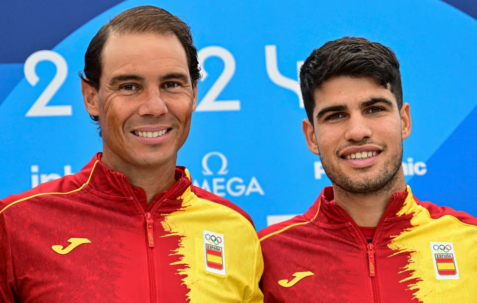 Spanish tennis stars Rafael Nadal (left) and Carlos Alcaraz  will play doubles together for the first time in the Olympics' tennis event.