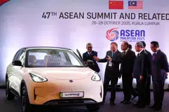 The Proton e.MAS 5, pictured above at the 47th Asean Summit, has been dubbed Malaysia’s “first affordable EV for the rakyat”.