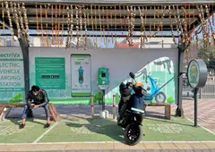 An Ola electric scooter being charged at an electric vehicle charging station in New Delhi, India, Feb 12, 2022. India has made significant investments in clean energy, adding more than 100 gigawatts of capacity in the last 10 years. 