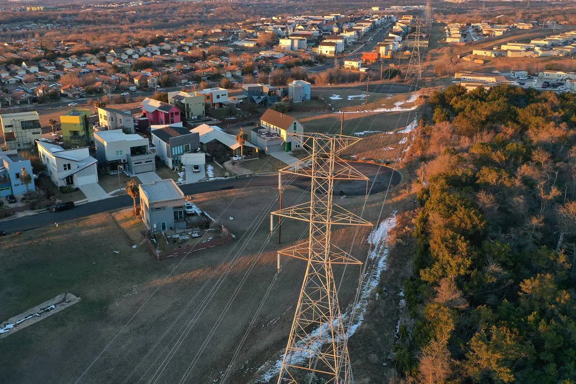 Electrical lines running through a neighborhood in Austin, Texas. Underinvestment in infrastructure is set to exacerbate inflationary pressures.