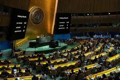 Screens show the voting result during the United Nations General Assembly vote on a draft resolution that would recognize the Palestinians as qualified to become a full UN member.