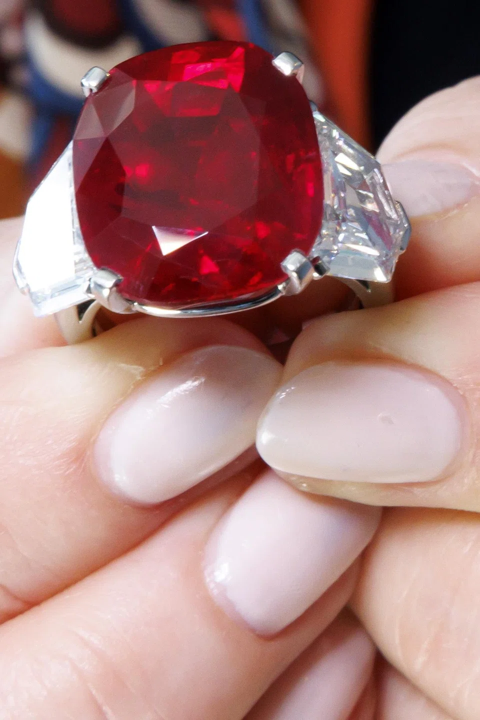 A 25.59-carat ruby ring from Cartier sold for 13 million Swiss francs, just missing its low estimate of 14 million Swiss francs