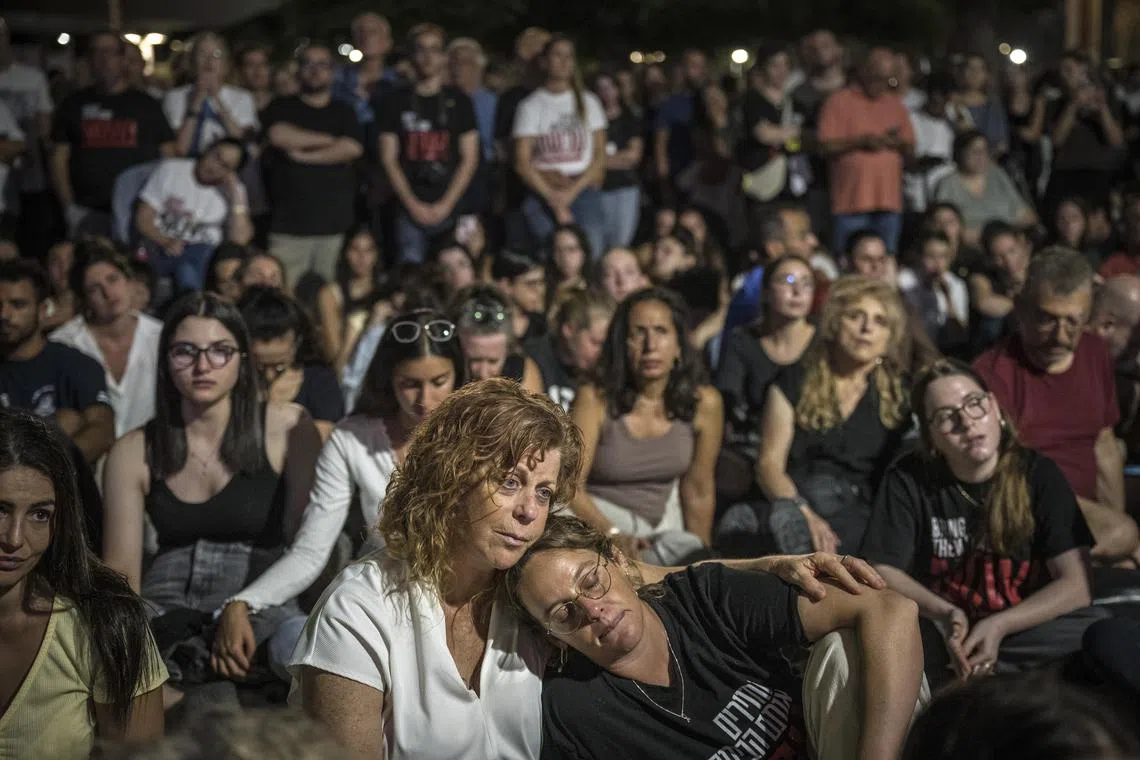 People attend a vigil on the eve of the anniversary of the Hamas attacks in Tel Aviv, Israel, Oct 6, 2024. 
