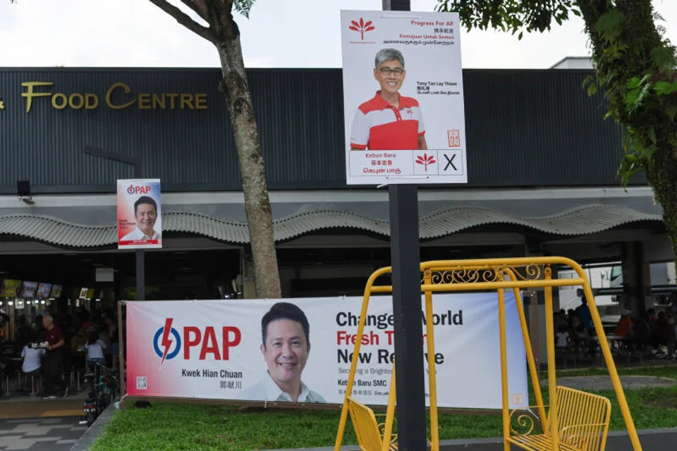 A poster of PAP's candidate for Kebun Baru SMC, Henry Kwek, alongside PSP's candidate, Tony Tan.