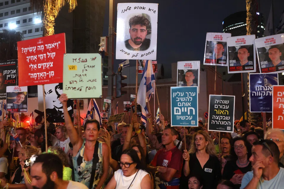 People attend a demonstration organised by families and friends of Israelis held hostage by Palestinian militants, Tel Aviv, Israel, Aug 17, 2025. 