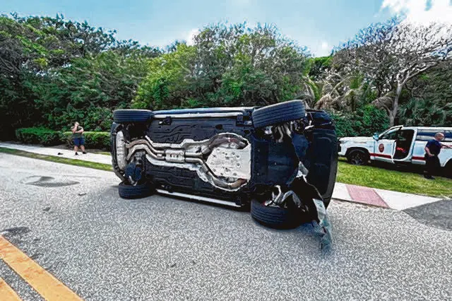 Tiger Woods' Land Rover rolled over on a two-lane road near his Jupiter Island home.