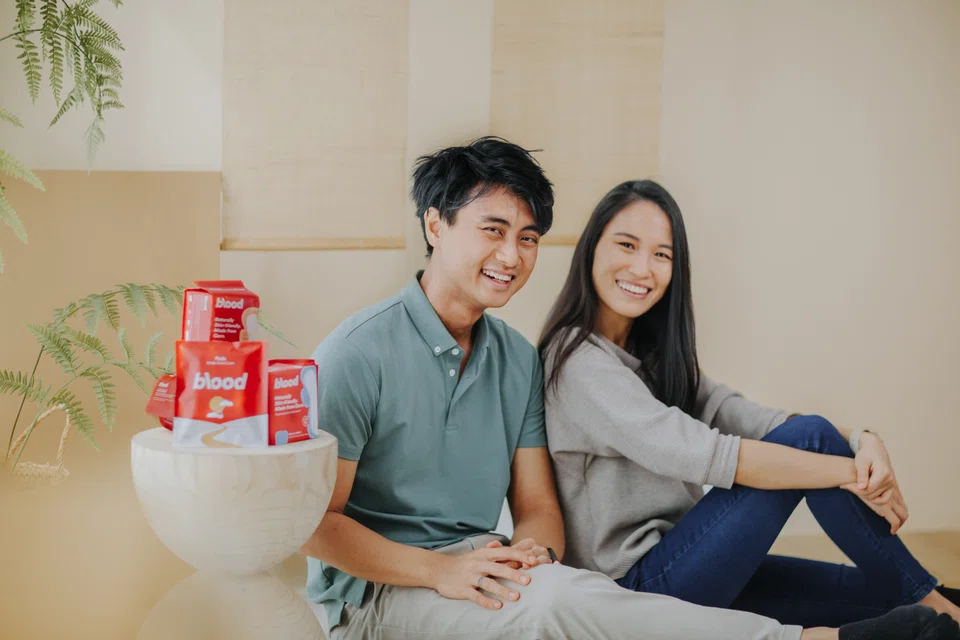 Husband-and-wife duo Caleb Leow (left) and Tan Peck Ying  started their period-pain-relief business in 2014 with a line of heating pads for menstrual pain.