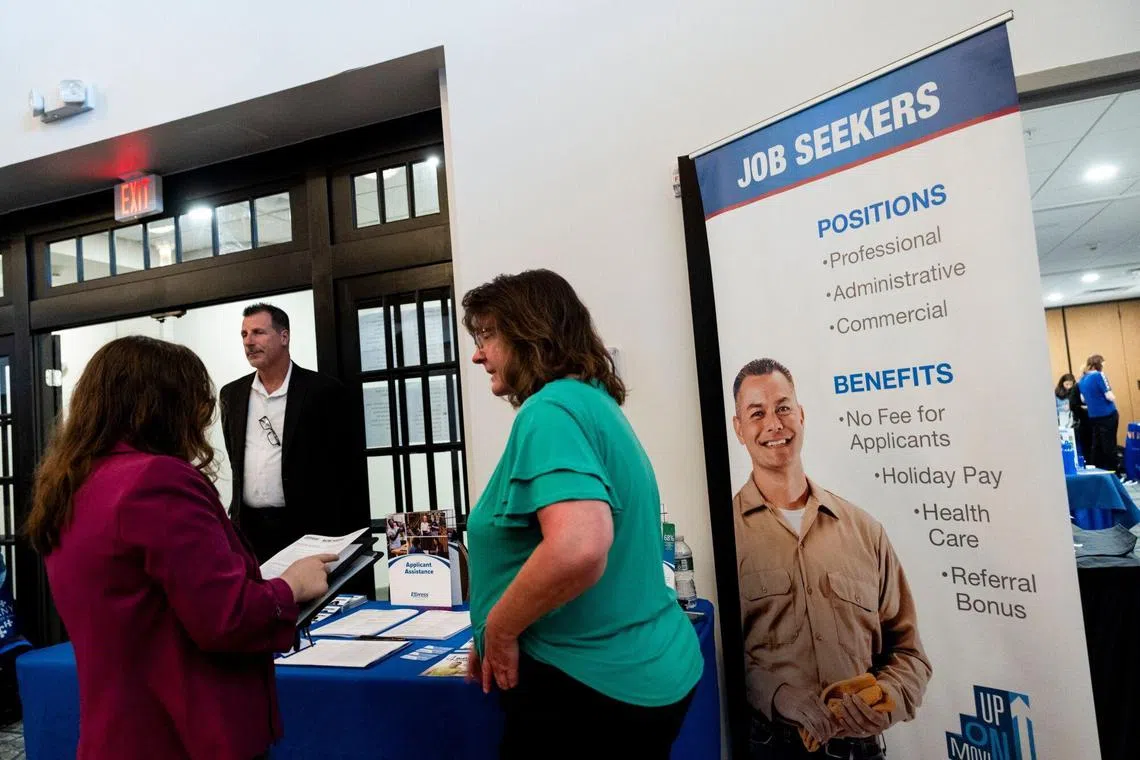 Attendees at a job fair in Latham, New York. After rising from 3.8% a year ago to 4.3% in July, the country's unemployment rate is back down to 4.1%.