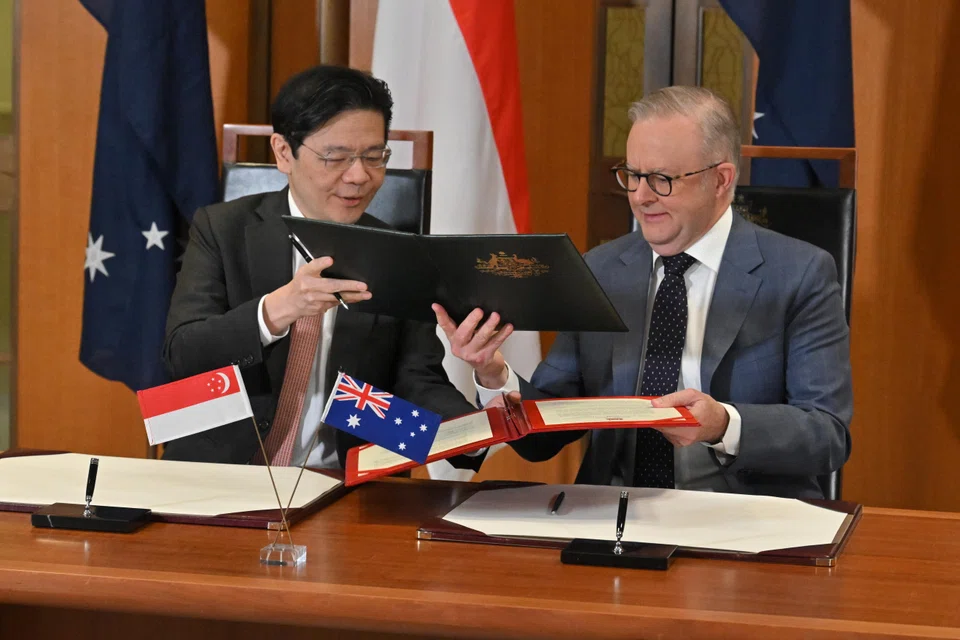 PM Wong (left) and Australian PM Anthony Albanese signed a Comprehensive Strategic Partnership agreement in Canberra on Oct 8, 2025.