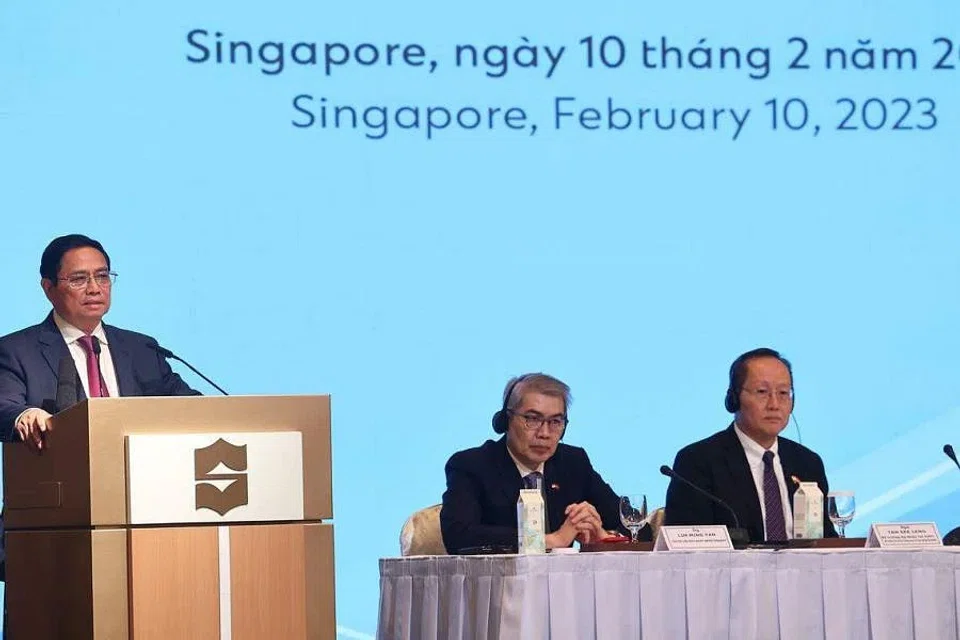 From Left: Vietnam Prime Minister Pham Minh Chinh speaking at the Vietnam Singapore Business Forum; Lim Ming Yan, chairman of the Singapore Business Federation and Tan See Leng, Second Minister for Trade and Industry. 