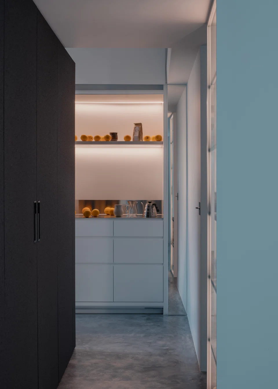 The pantry work top is supported by the storage pod.