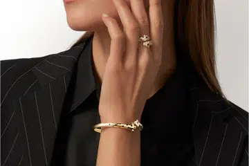 Model wearing Cartier Panthere ring and bracelet