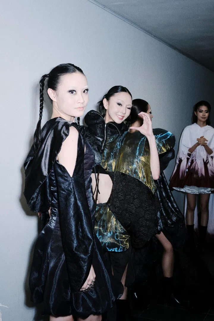 Models lined backstage