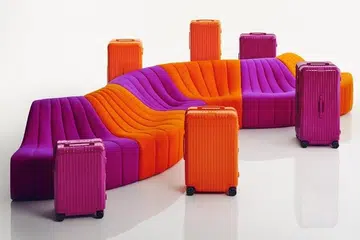 Rimowa orange and magenta luggage
