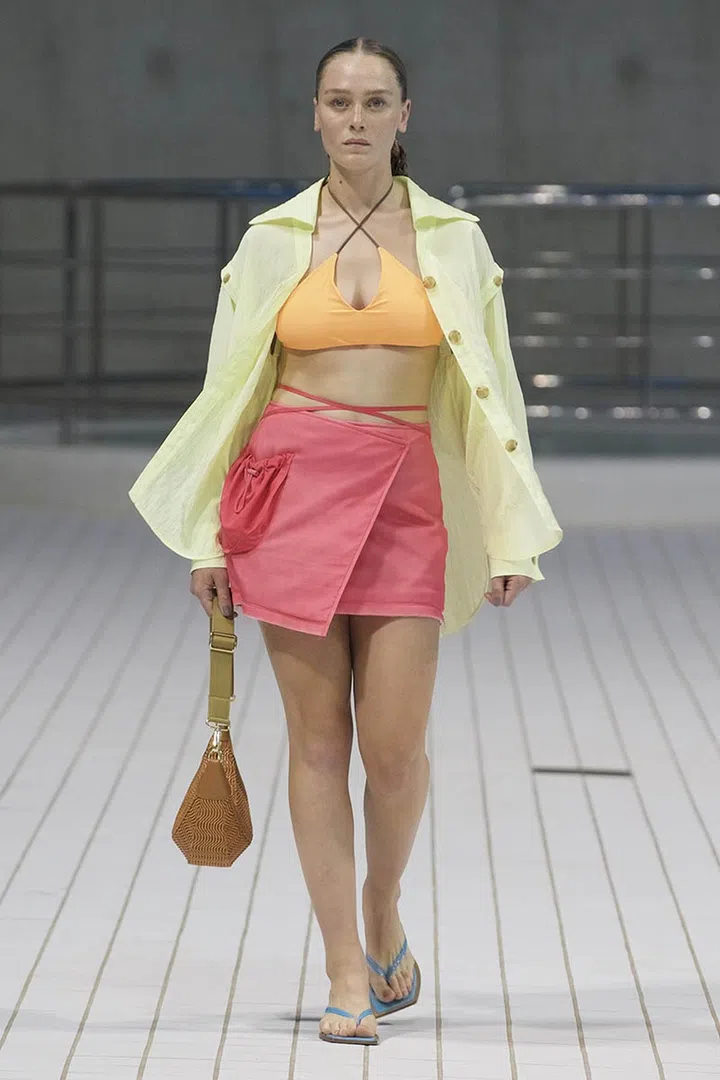 A model walking on runway wearing Rejina Pyo Spring Summer 2022 Women Ready to Wear Fashion Show on September 2021 in London, UK