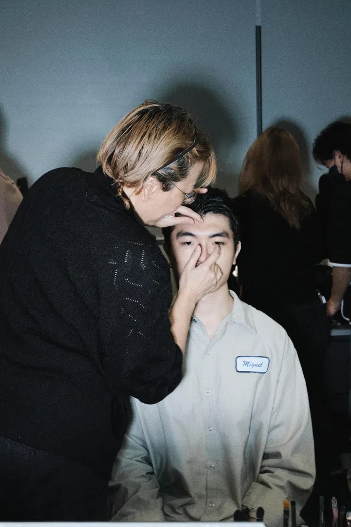 Model getting makeup done