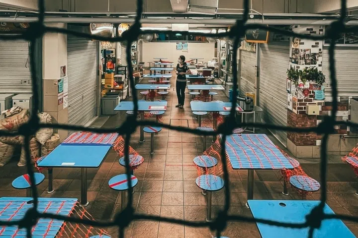 A shot of Golden Mile Food Centre at night.