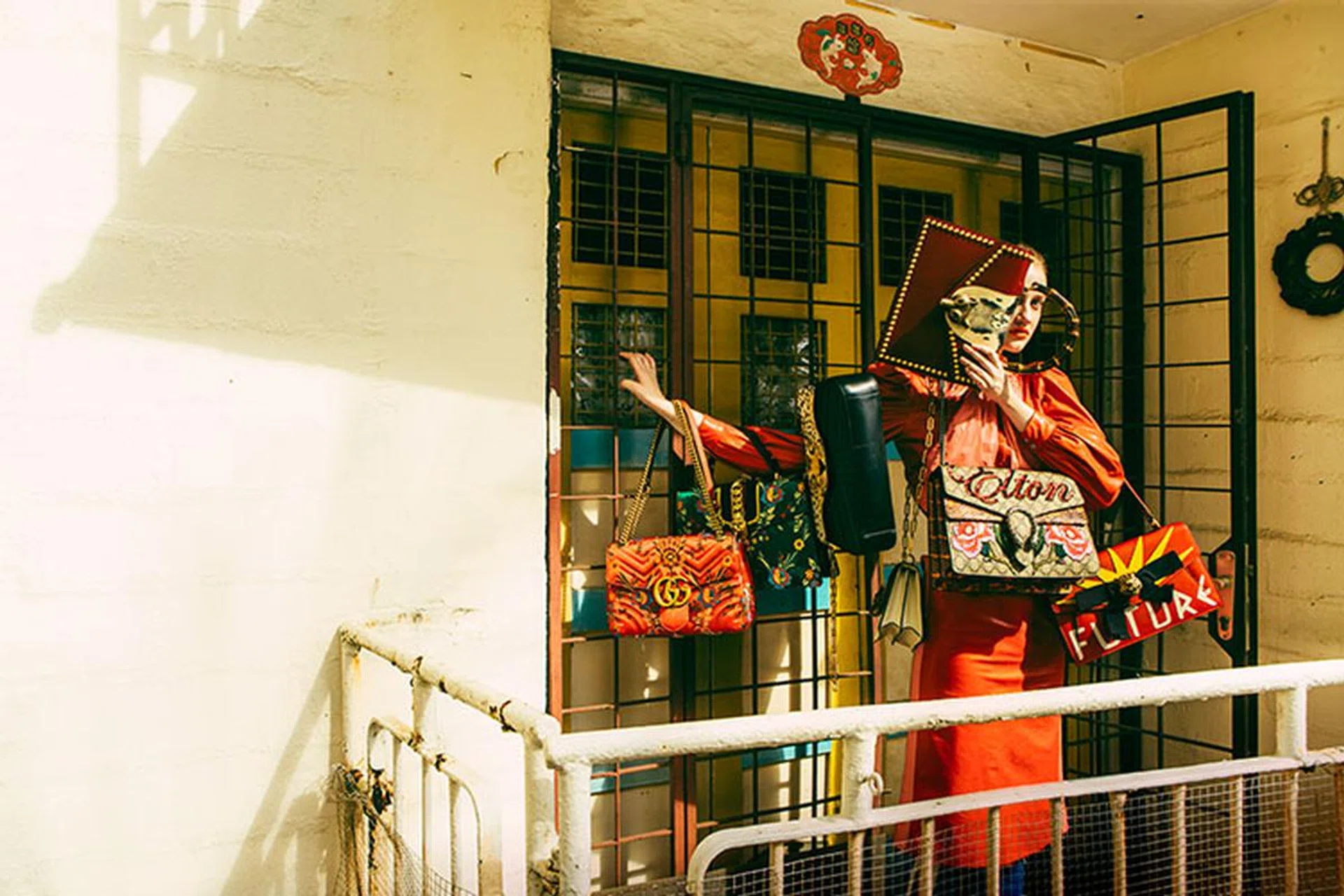 From left (all bags in medium unless stated): GG Marmont jacquard shoulder bag, Sylvie jacquard top-handle bag, Bamboo leather and calfhair top-handle bag with bamboo handle, small Broche leather and snakeskin shoulder bag, (in left hand) Broche leather and snakeskin top-handle bag with bamboo handle, Dionysus embroidered canvas and snakeskin shoulder bag with sequins, Fiocco leather shoulder bag, calfskin bomber jacket, matching pencil skirt, and jersey leggings, Gucci