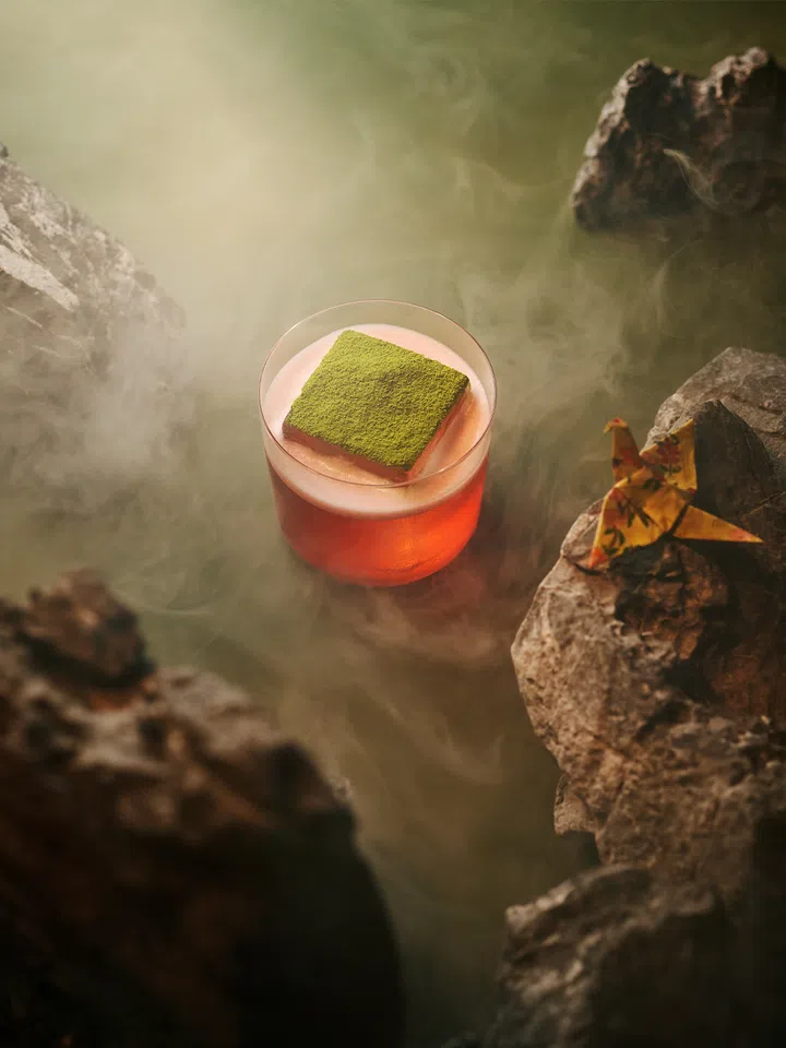 Close-up of Koma Marina Bay Sands’ Heavenly Match-A cocktail with pink strawberry matcha and dusted with green tea powder