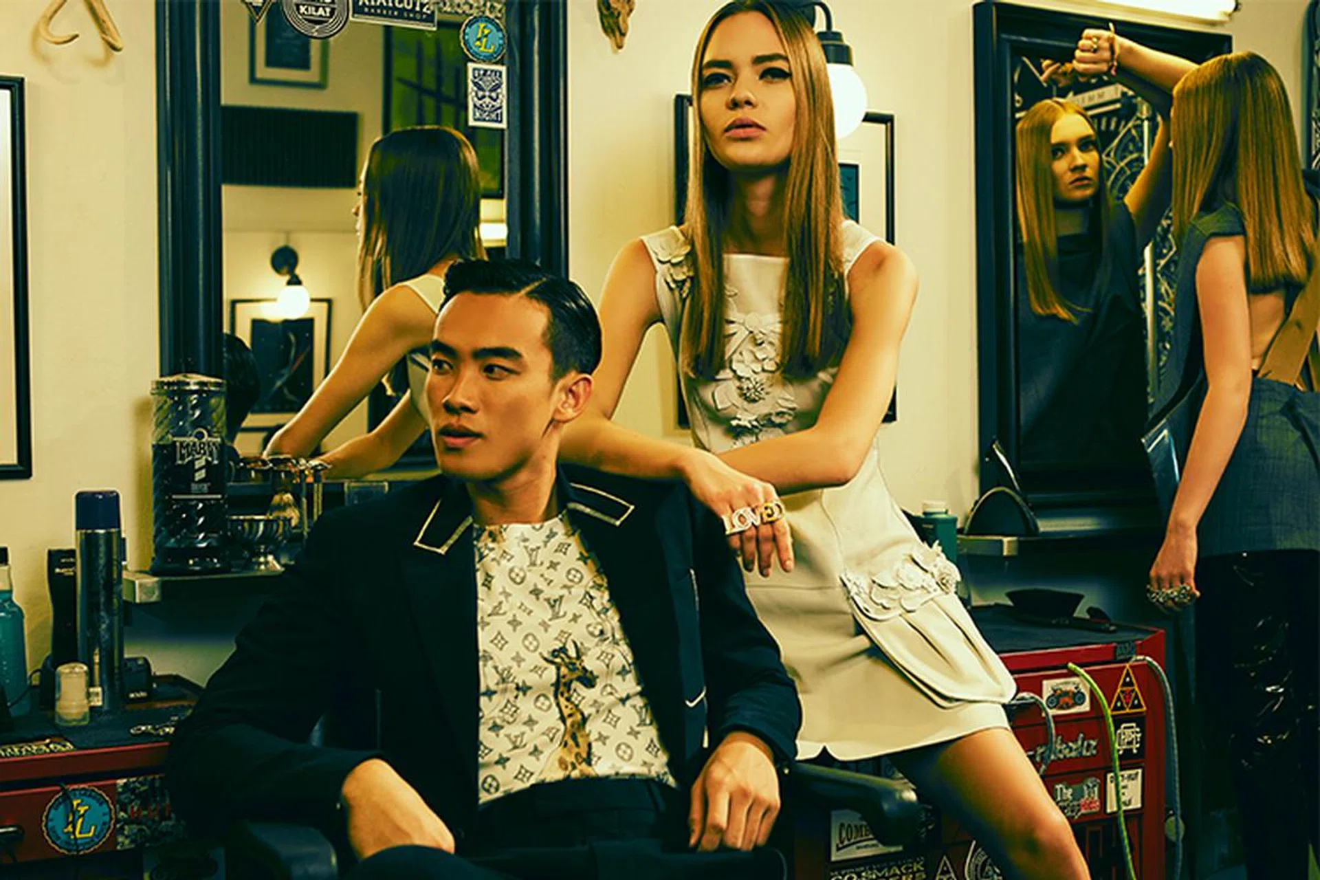 On Lim:  Wool blazer, matching pants, and cotton T-shirt, Louis Vuitton. On models: (Centre) Leather dress, Fendi. Metal knuckleduster with crystals, Gucci. (Right) Toga polyester dress and vinyl pants, Club 21 Forum. Metal knuckleduster with crystals and matching ring, Gucci 