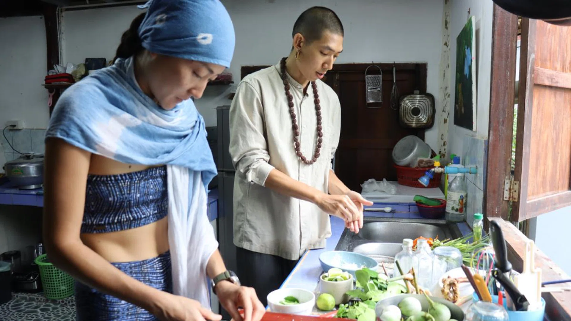 Former fashion designer/DJ Linda Hao (left) and fashion stylist Marcus Choo (right) prepare a feast for Omm Home, the spiritual-meets-creativity platform that Hao started in Johor Bahru seven years ago and uprooted to Koh Phangan last year. Credit: Omm Home