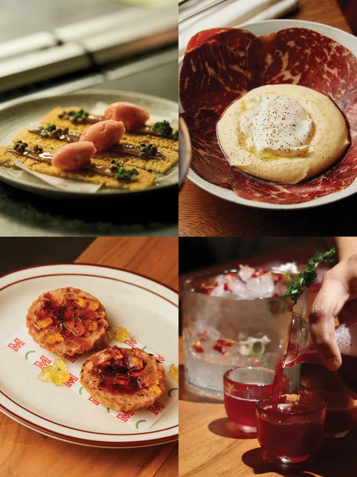 Interior of Movida Spanish restaurant at Raffles City Singapore with brick-red walls, stone ceiling and intimate dining space for tapas and wine