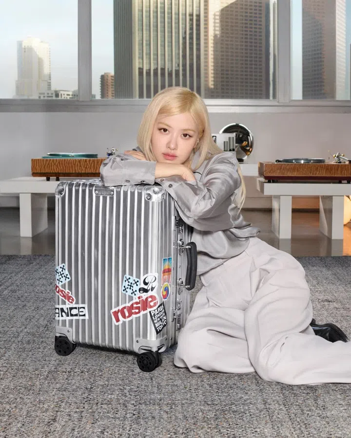 rose rimowa f1 messy song louis hamilton