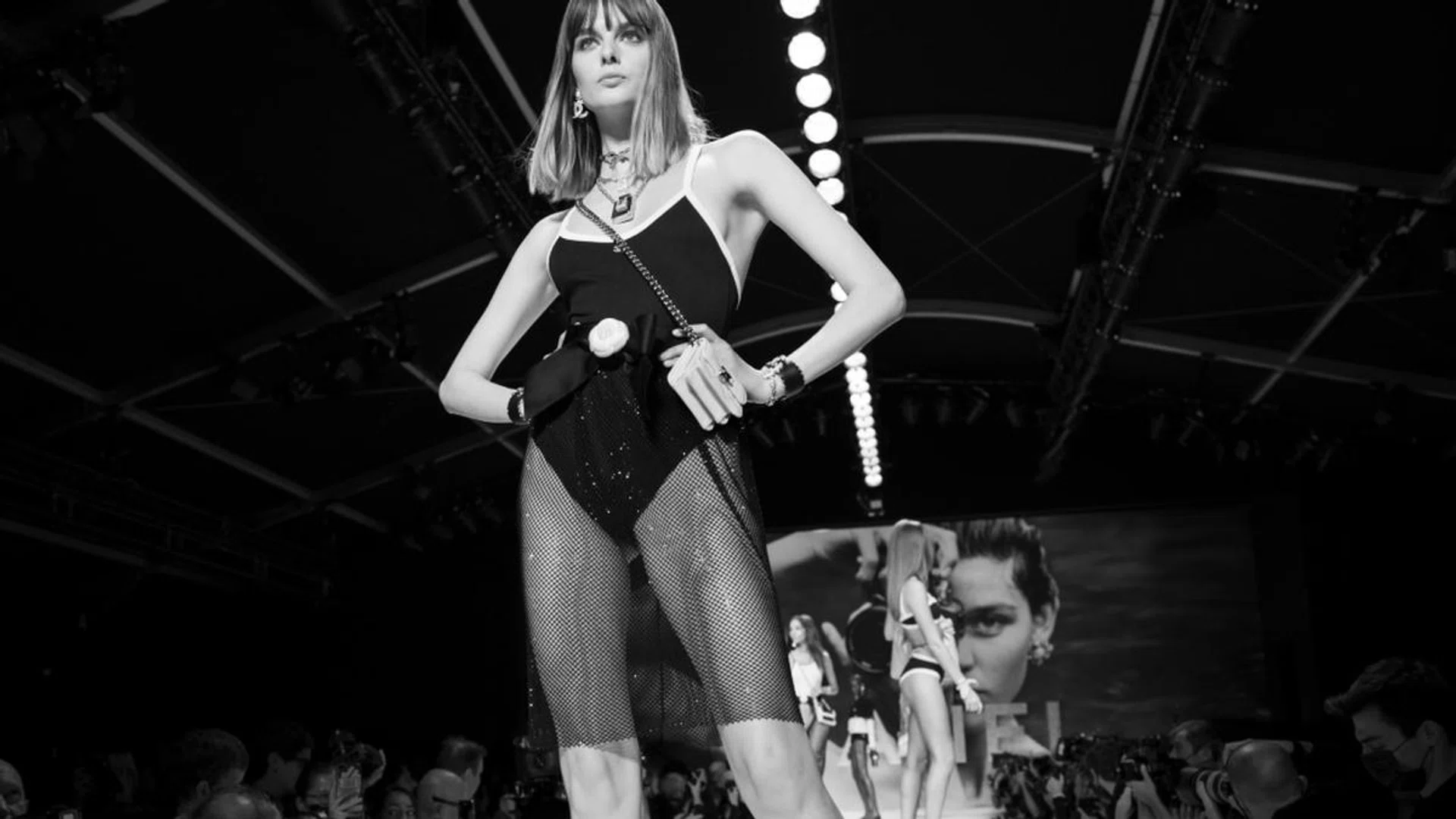 Turning up the temperature, swimsuits for Spring/Summer 22 are doubling up as  everyday wear too – like this Chanel stretch ribbed jersey swimsuit ($1,200) paired with a chic mesh-blend skirt ($4,810). Credit: Inez & Vinoodh