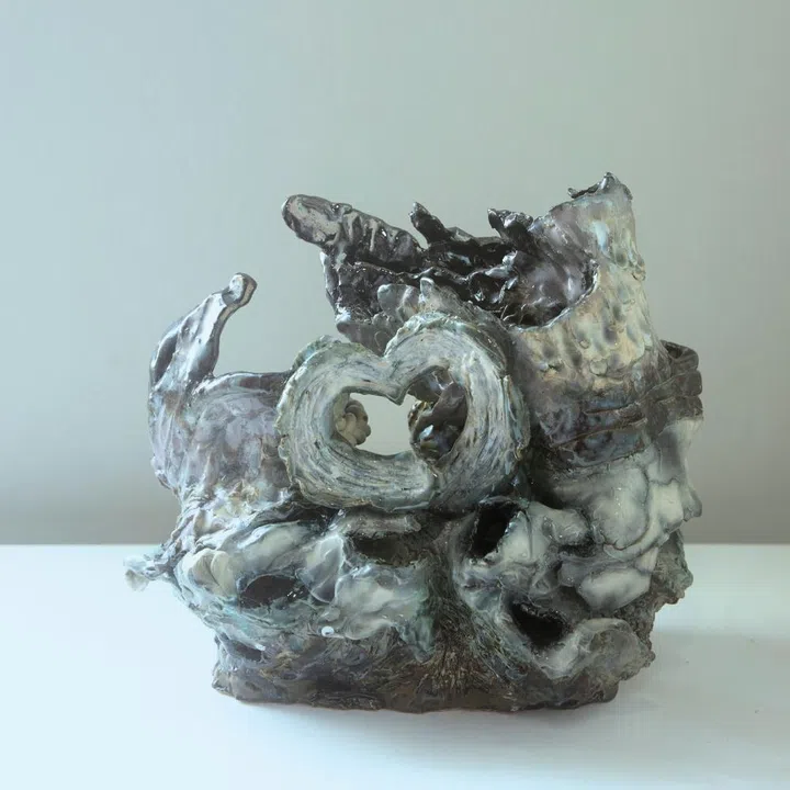 Ceramic sculpture “Cradled by the Hands Of” by Hilary Yeo, inspired by the Bottega Veneta Baby Veneta bag for F ZINE.