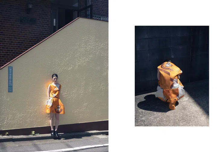 Japanese photographer Osamu Yokonami model standing in orange dress