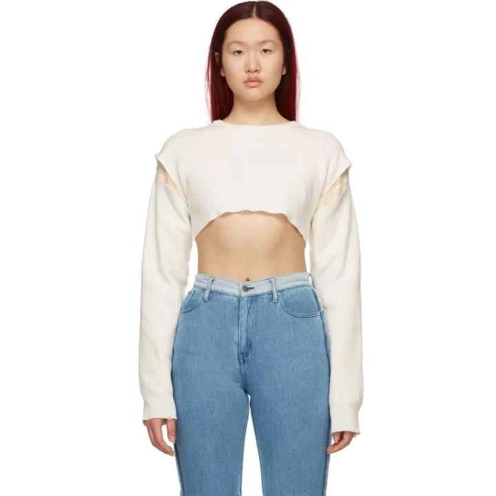 A model wearing a cropped Perverze sweatshirt.