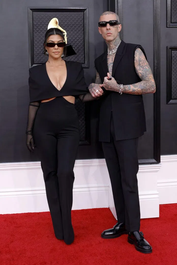 LAS VEGAS, NEVADA - APRIL 03: (L-R) Kourtney Kardashian and Travis Barker attend the 64th Annual GRAMMY Awards at MGM Grand Garden Arena on April 03, 2022 in Las Vegas, Nevada. (Photo by Frazer Harrison/Getty Images for The Recording Academy)