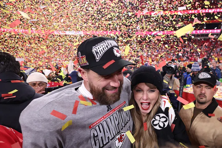 KANSAS CITY, MISSOURI - JANUARY 26: Taylor Swift celebrates with Travis Kelce #87 of the Kansas City Chiefs after defeating the Buffalo Bills 32-29 in the AFC Championship Game at GEHA Field at Arrowhead Stadium on January 26, 2025 in Kansas City, Missouri.  (Photo by Jamie Squire/Getty Images)