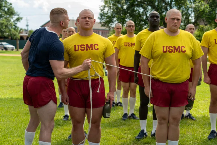 BOOTS. (L to R) Nicholas Logan as Sgt. Howitt, Brandon Tyler Moore as Cody Bowman and Blake Burt as John Bowman in Episode 102 of Boots. Cr. Alfonso "Pompo" Bresciani/Netflix © 2023
